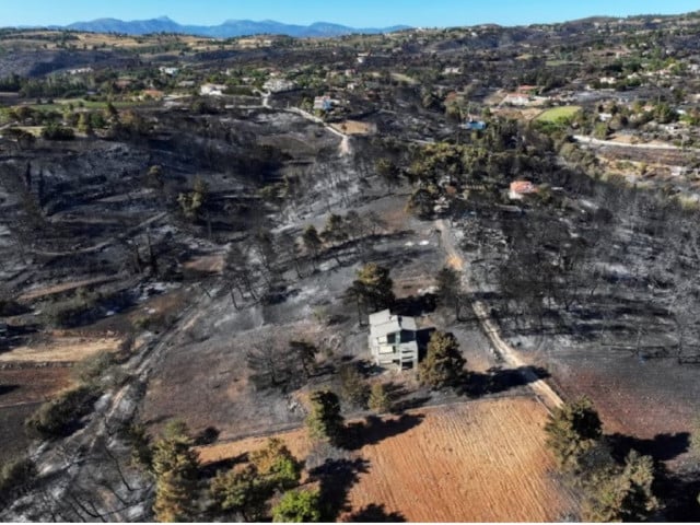 a drone view shows a charred forest area following a wildfire in the village of varnavas greece august 13 2024 photo reuters